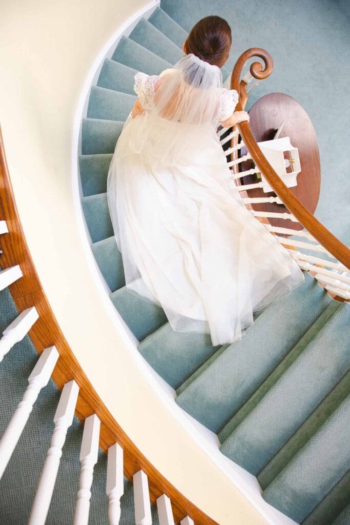 a bride walking down staircase destination wedding photography