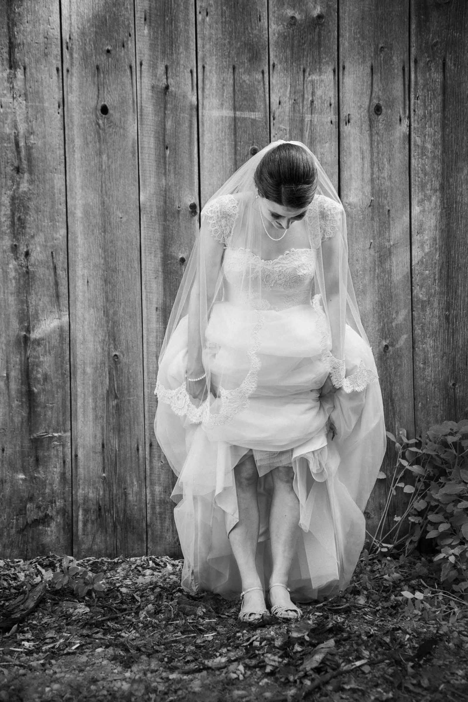bride standing in mud