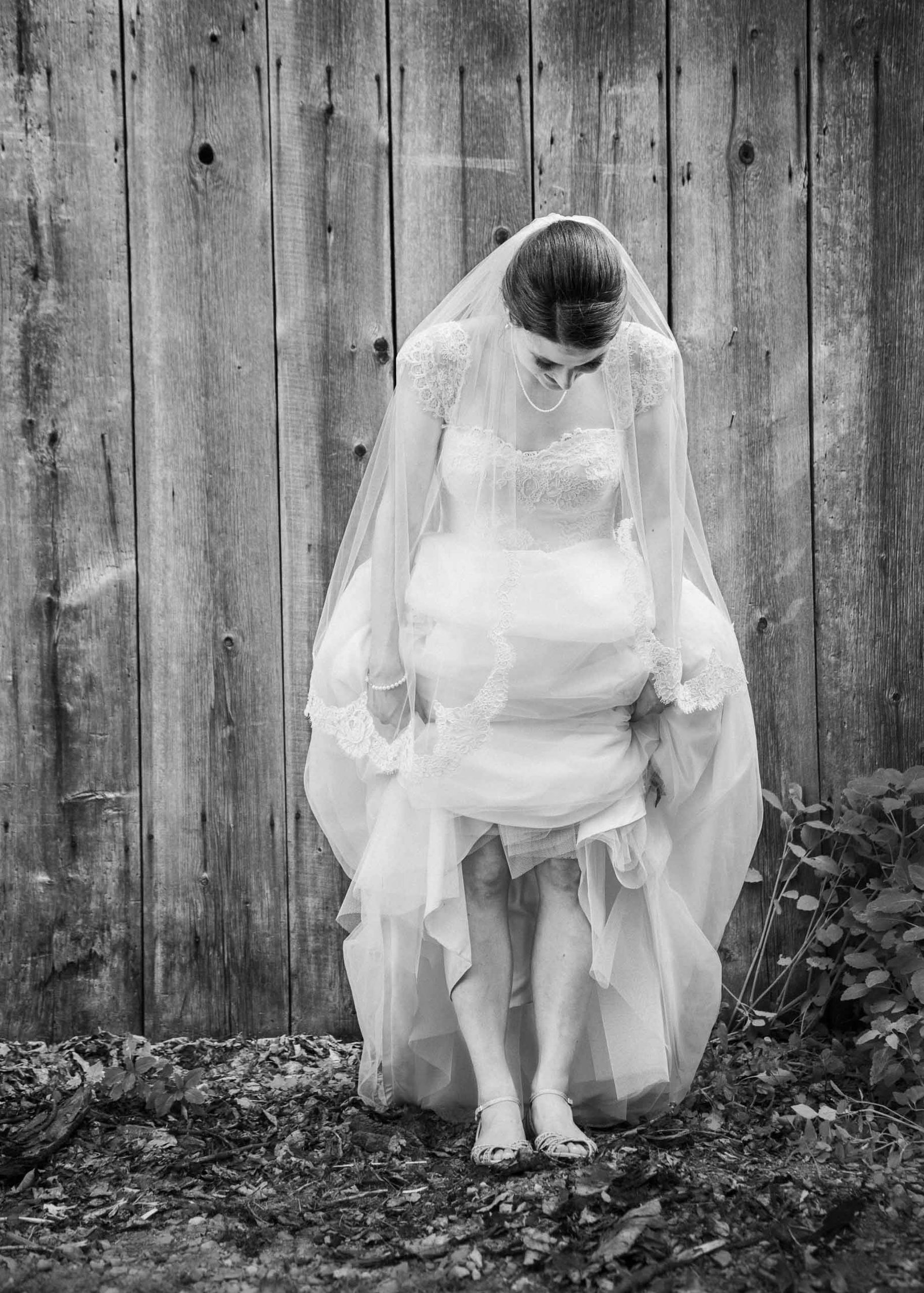 bride standing in mud