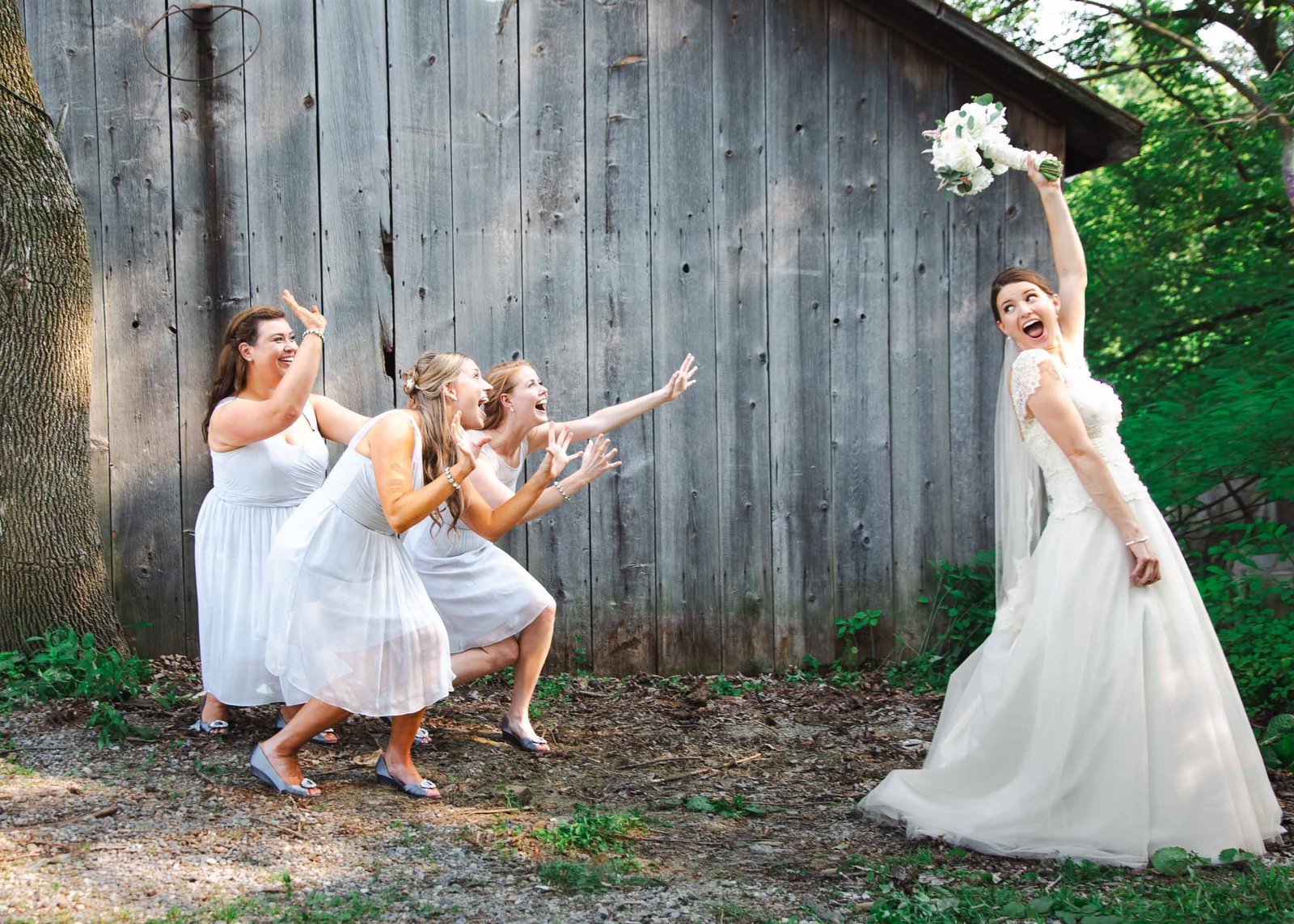 bride tossing bouquet