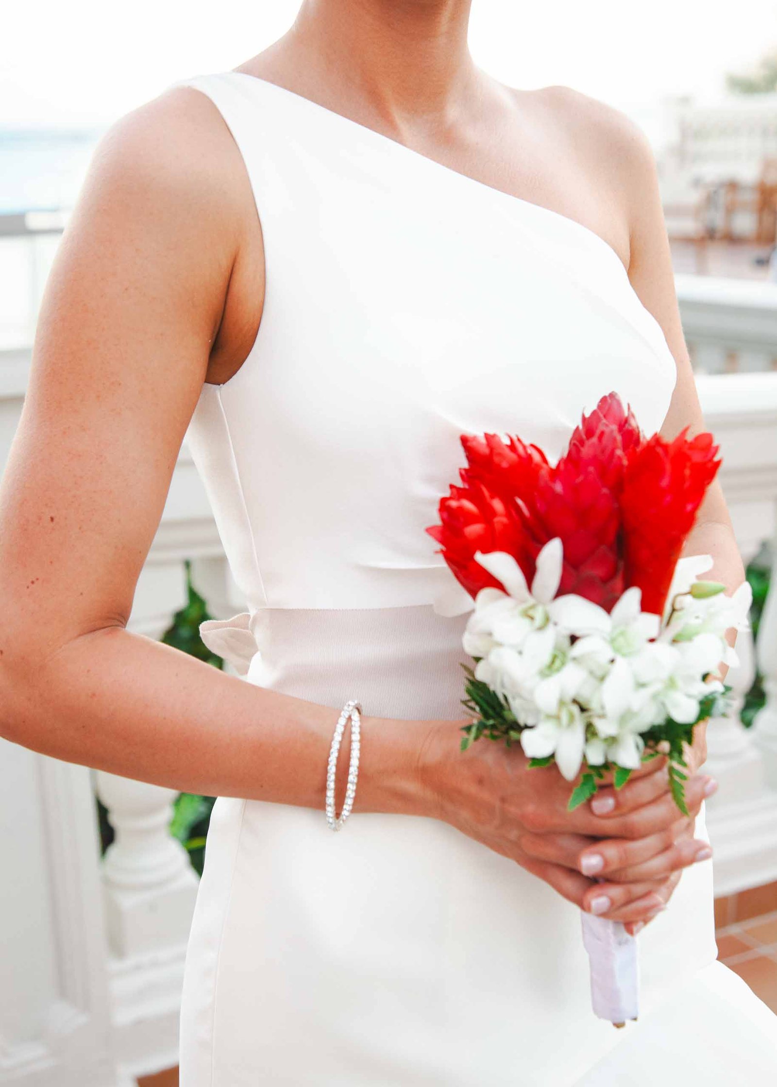 close up of a bride holding flower bouquet