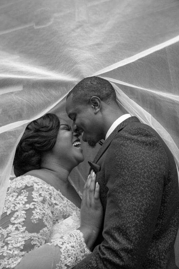 couple under wedding veil